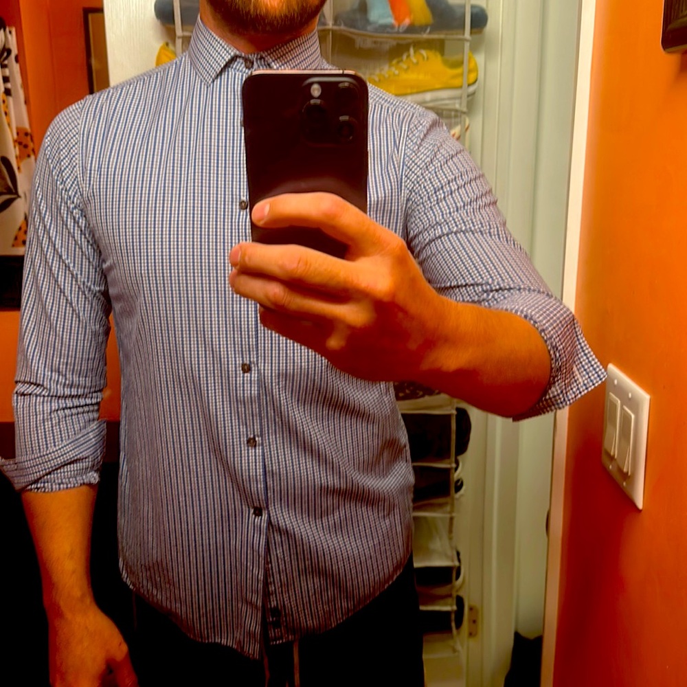 Men’s blue checked button up dress shirt.